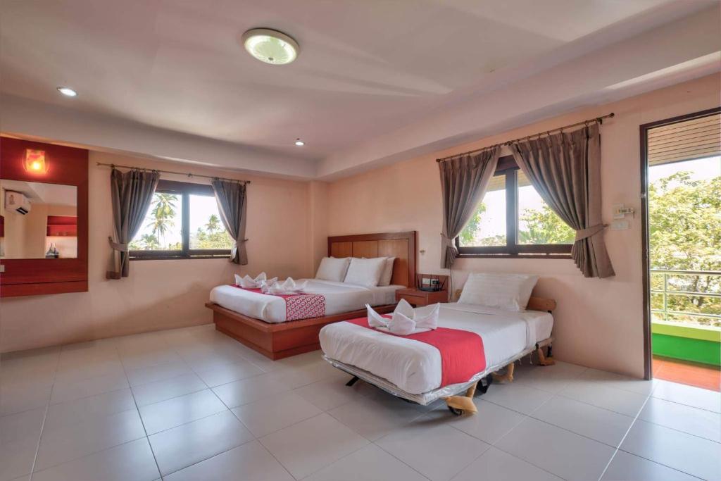 Postel nebo postele na pokoji v ubytování Rak Samui Residence