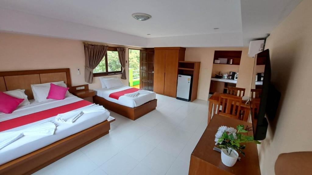 Postel nebo postele na pokoji v ubytování Rak Samui Residence