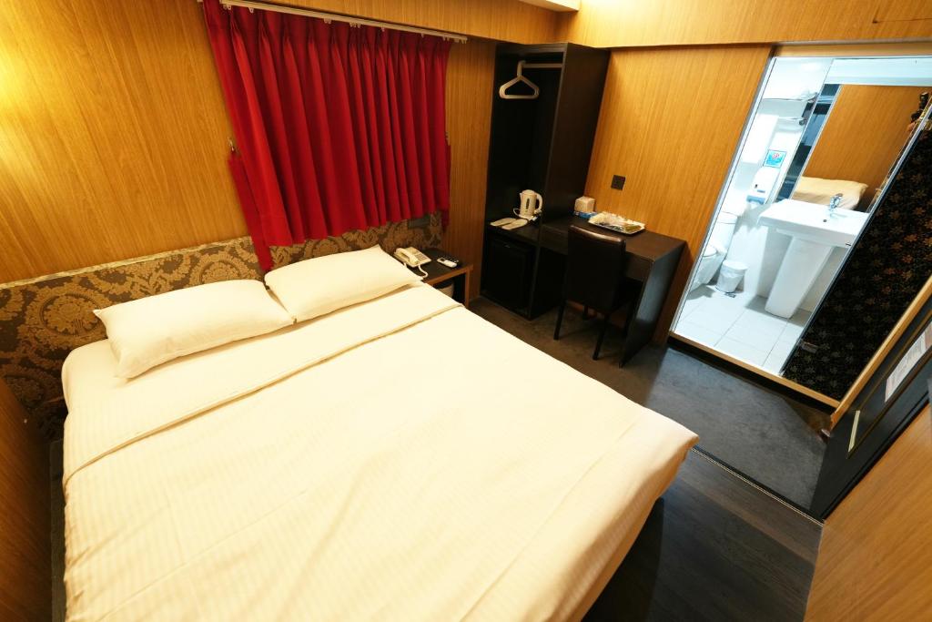 Postel nebo postele na pokoji v ubytování Meworld Hotel - Ximen