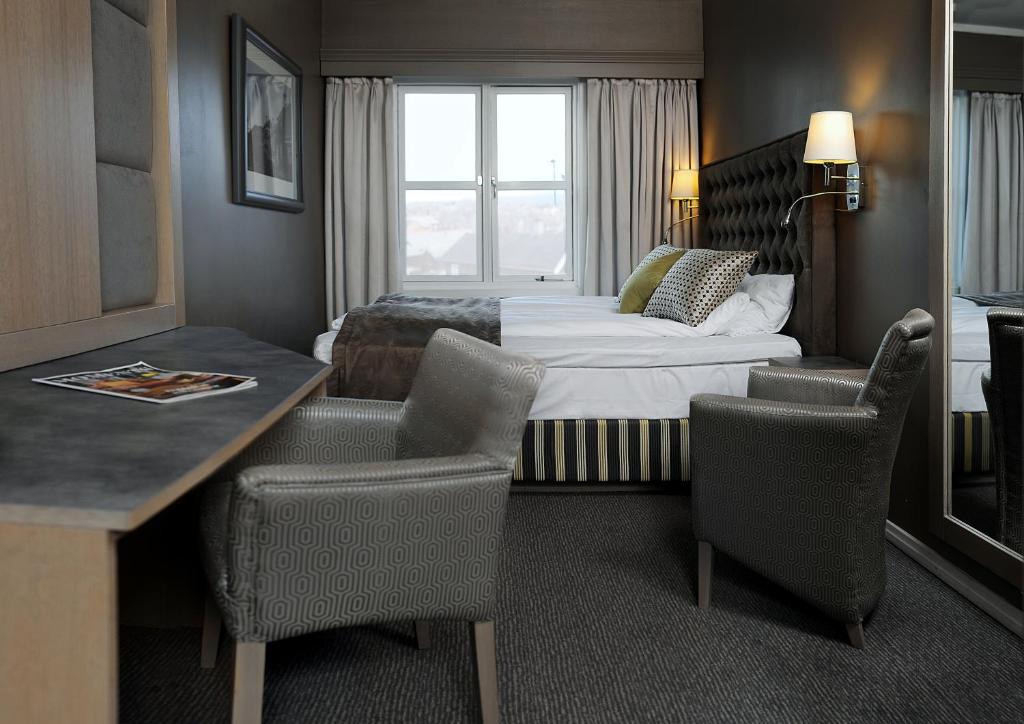 Postel nebo postele na pokoji v ubytování Bergstadens Hotel & Spa