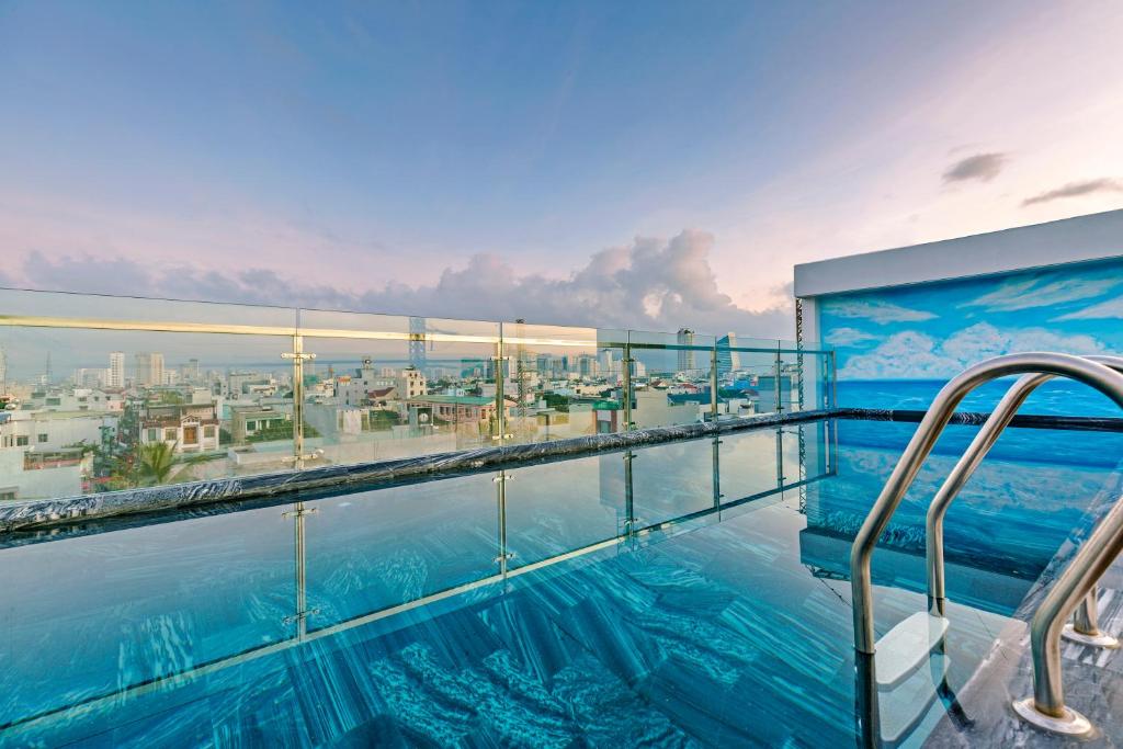 a swimming pool on the top of a building at Lyn's Hotel & Apartment in Da Nang