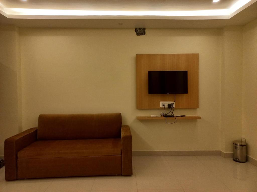 TV a/nebo společenská místnost v ubytování Hotel Ridley International