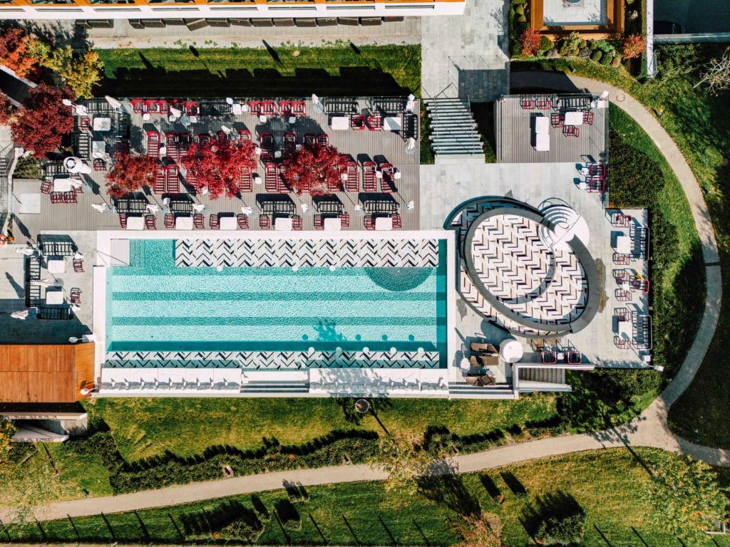 an aerial view of a resort with a swimming pool at FIVE Zurich - Luxury City Resort in Zürich