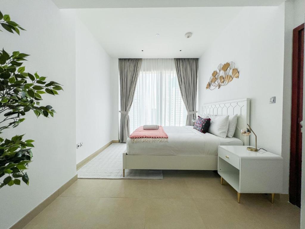 Postel nebo postele na pokoji v ubytování High Floor - Beautiful 1BR Dubai Marina Gate