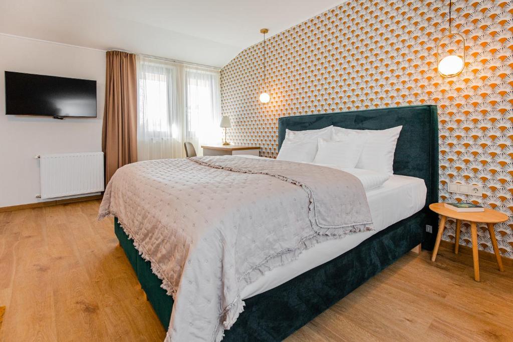 Postel nebo postele na pokoji v ubytování H11 ROOMS ESZTERGOM