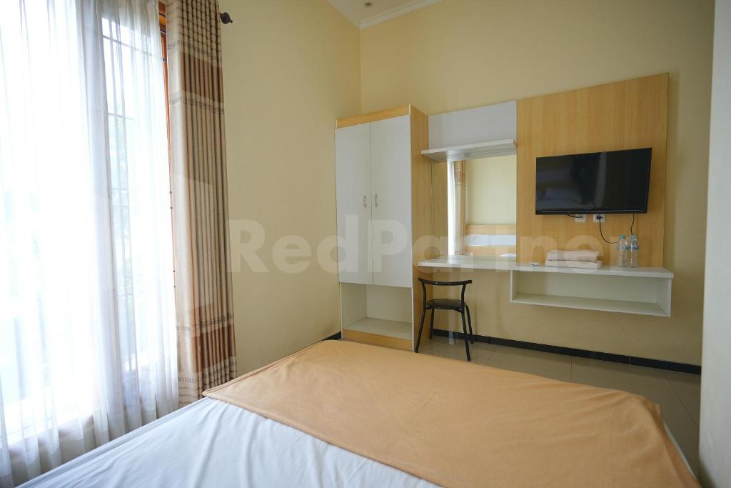 One & Quin Guest House Syariah Mitra RedDoorz - 标准双人间