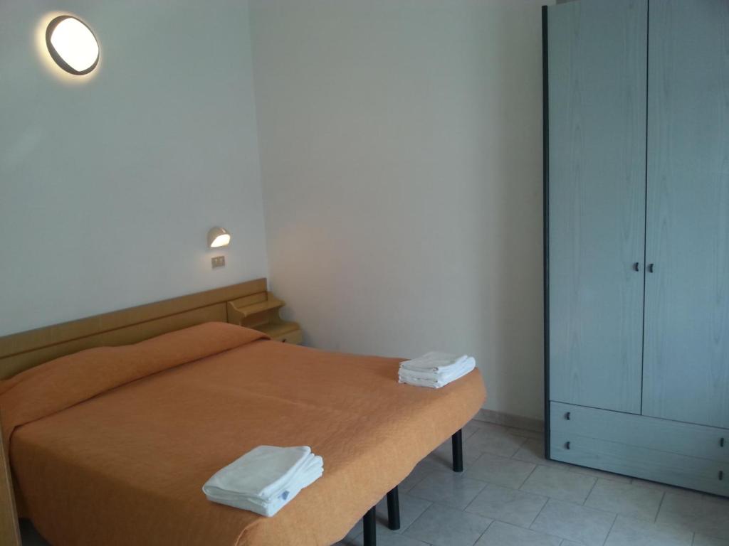 Postel nebo postele na pokoji v ubytování Hotel Marylise