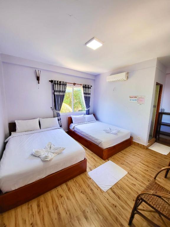 Roomy Guesthouseにあるベッド