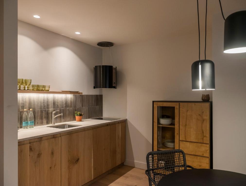 Kuchyň nebo kuchyňský kout v ubytování Can Verí Suites