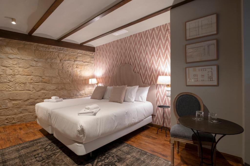 Postel nebo postele na pokoji v ubytování Hotel Cetina Palacio de los Salcedo