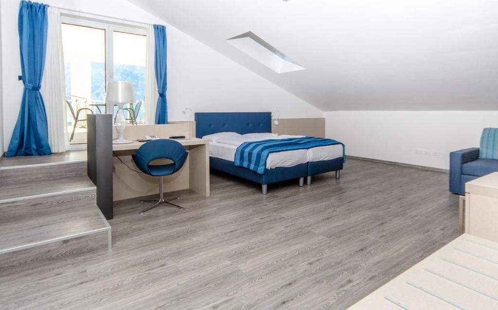 Postel nebo postele na pokoji v ubytování Hotel Benacus Panoramic