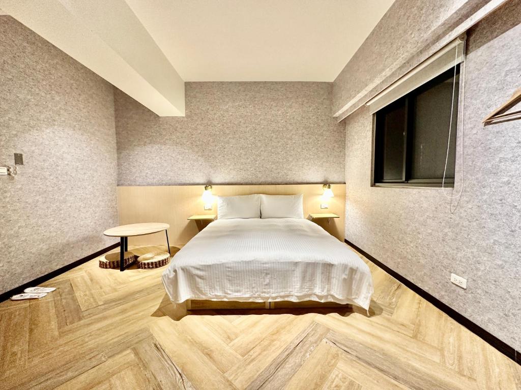מיטה או מיטות בחדר ב-茗居 House