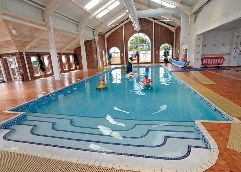 ein großer Pool mit einem Gemälde auf dem Boden in der Unterkunft CT28 Three Bedroom Holiday Home, close to Heated Pool, Amusements and Beach Fantastic Facilities & Top rated holiday park in North Wales PASSES NOT INCLUDED in Rhyl