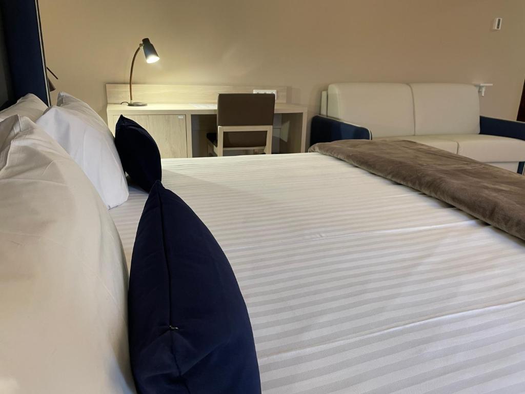 Postel nebo postele na pokoji v ubytování Hotel Maria Cristina