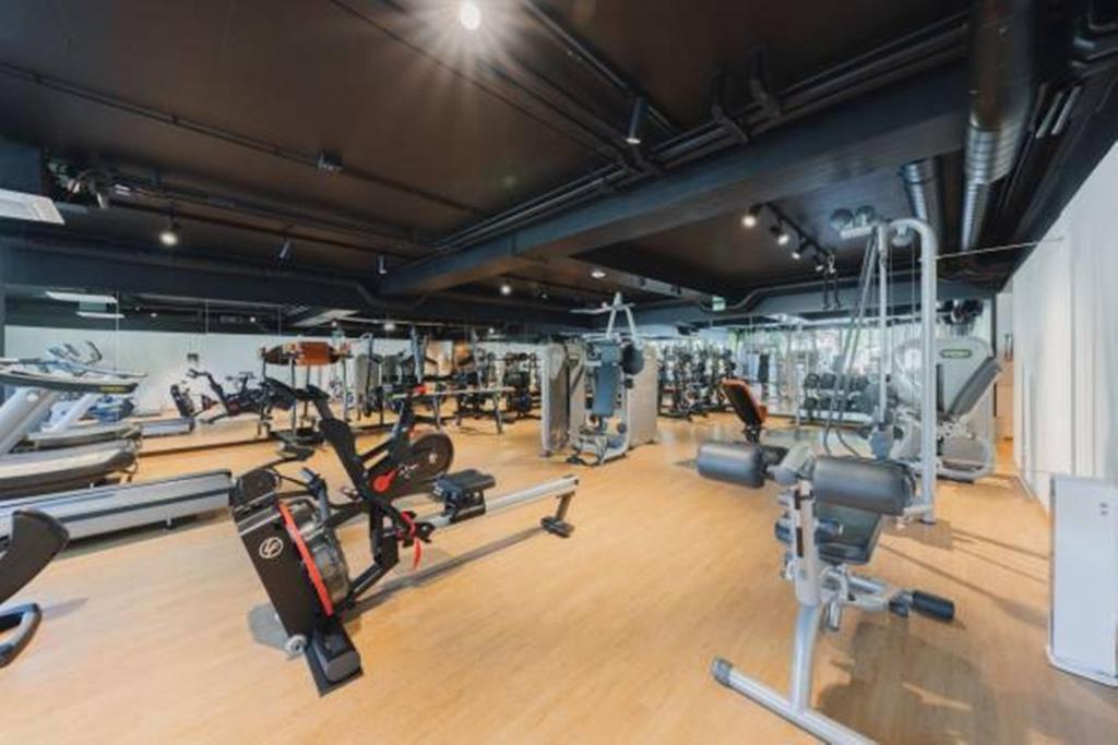 a gym with several treadmills and cardio machines at Alpenhotel Montafon & SPA in Schruns