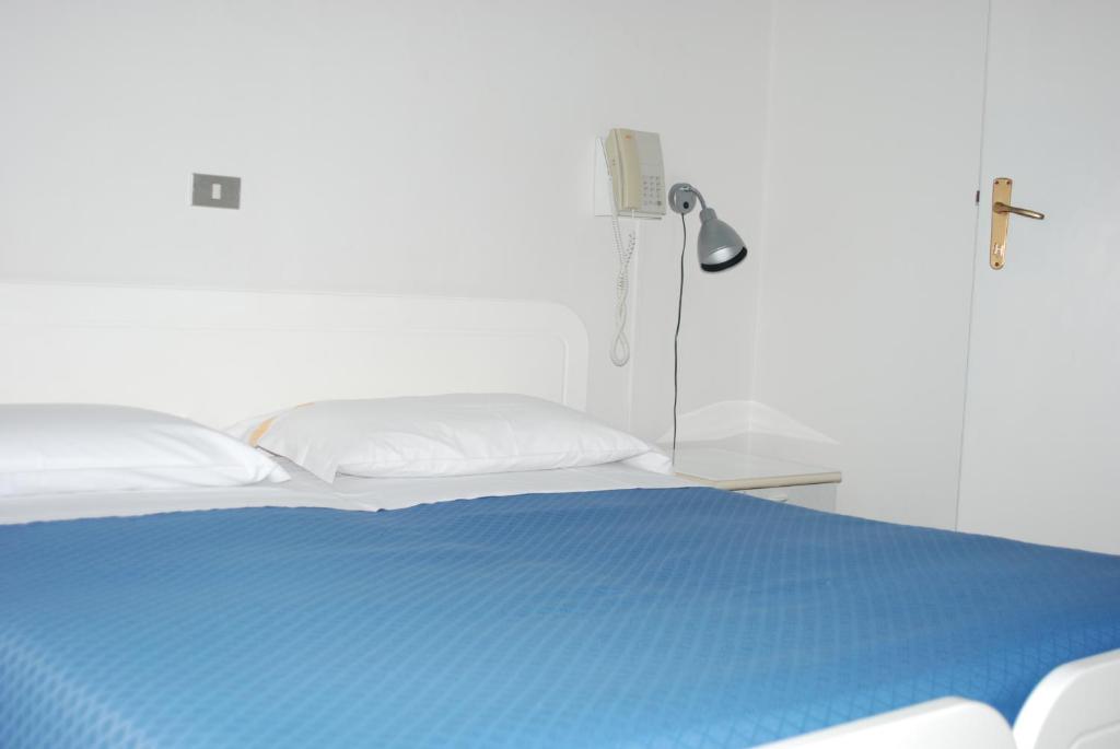 Postel nebo postele na pokoji v ubytování Hotel Tuscolano