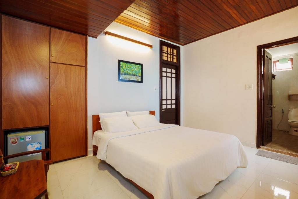 Postel nebo postele na pokoji v ubytování An Hiên Homestay Hội An