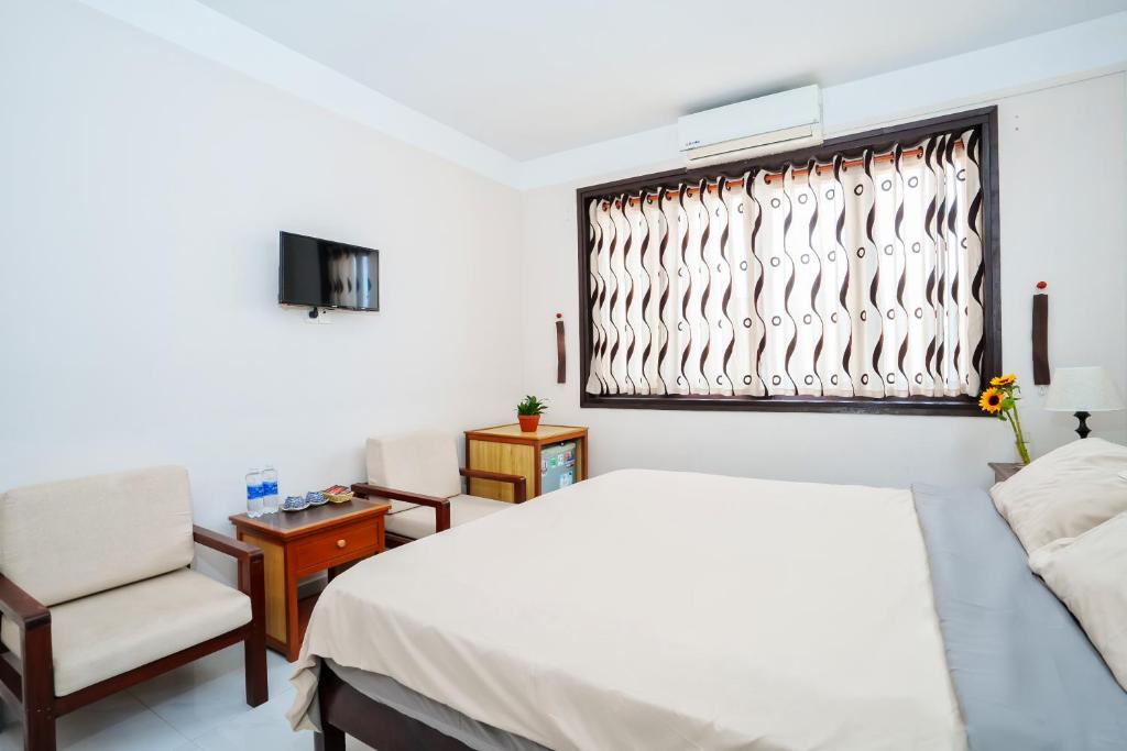 Postel nebo postele na pokoji v ubytování An Hiên Homestay Hội An