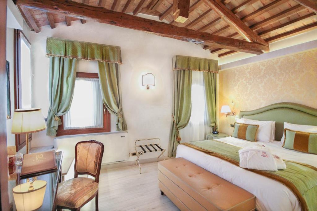 Postel nebo postele na pokoji v ubytování Hotel Colombina