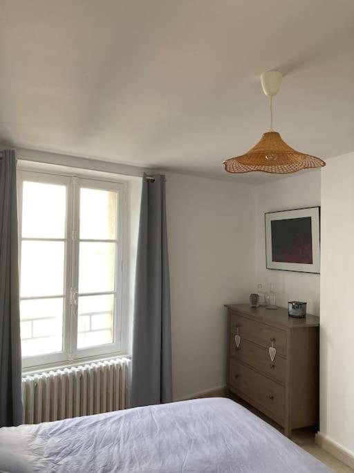 Televízia a/alebo spoločenská miestnosť v ubytovaní Appartement Les Corsaires