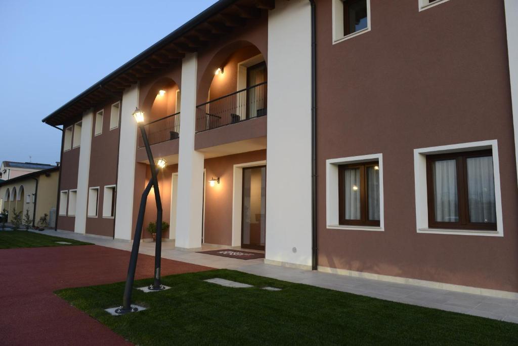 a rendering of a building with a courtyard at L'Insolito Posto in Sabbioncello