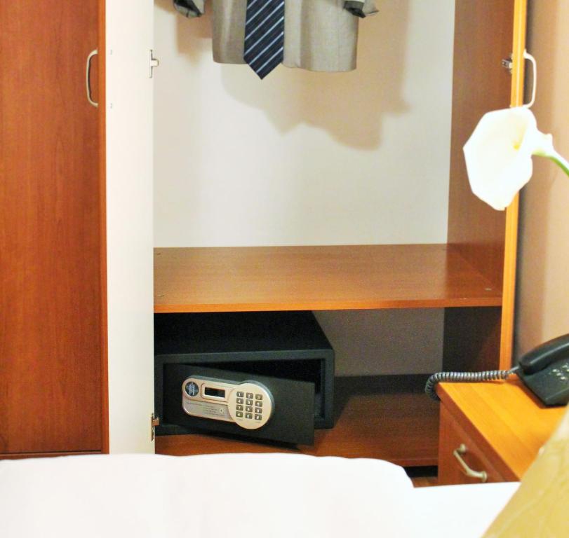 Postel nebo postele na pokoji v ubytování Hotel Rex