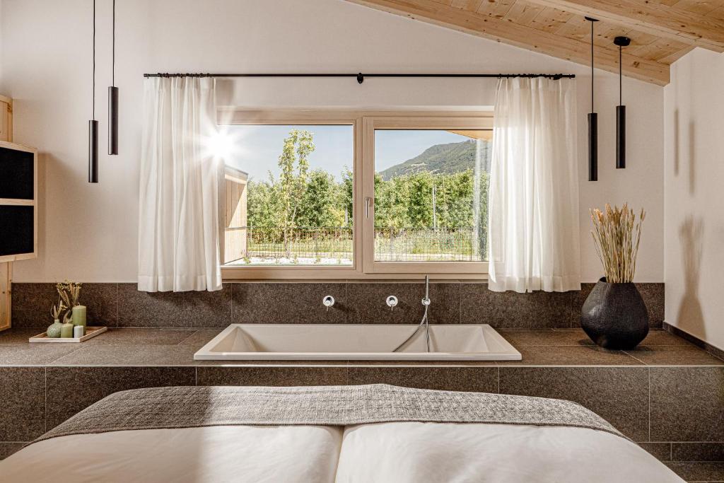 Postel nebo postele na pokoji v ubytování Amolaris Garden Lodges & Guesthouse