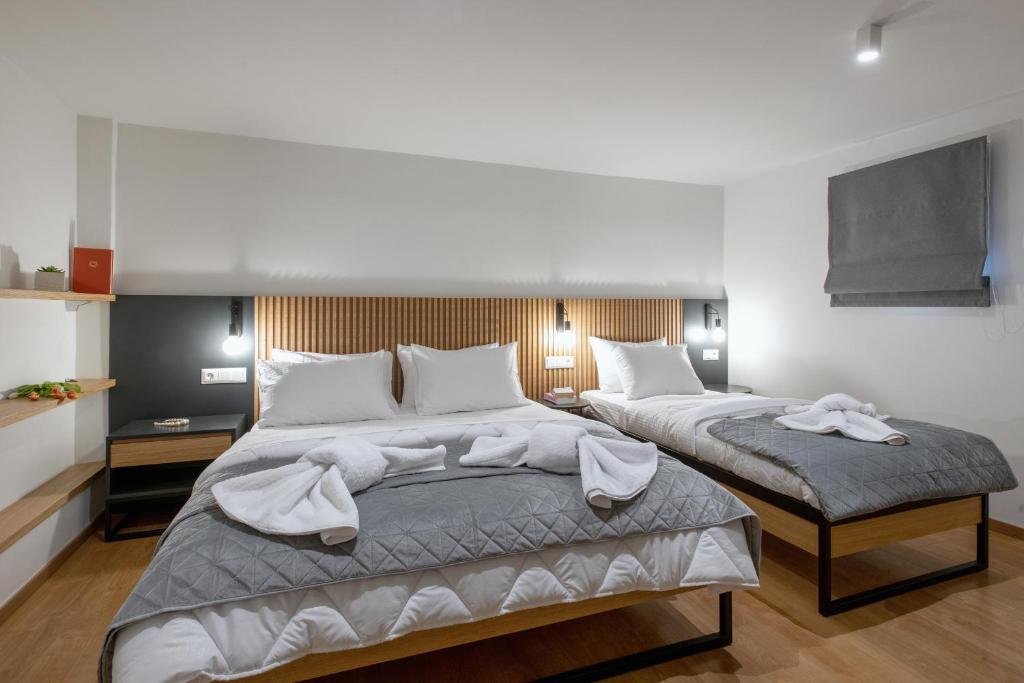 Postel nebo postele na pokoji v ubytování Traveleclectic Apartments