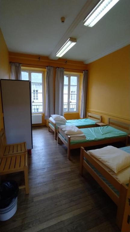 Postel nebo postele na pokoji v ubytování Logis des Grands Chapeaux