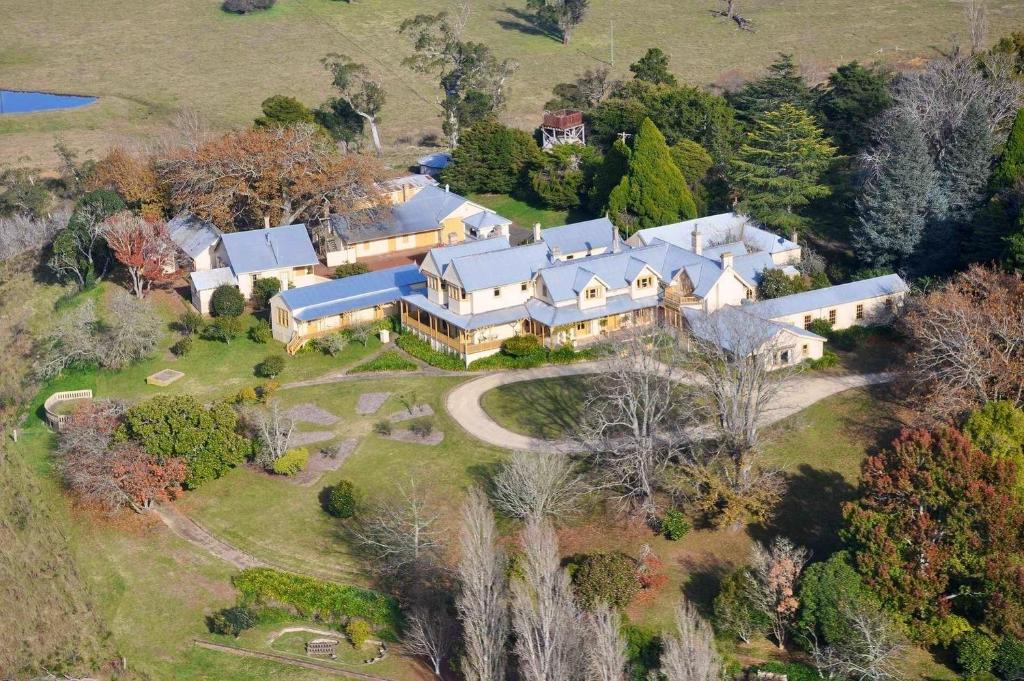 an aerial view of a large house on a hill at Hillview Heritage Estate in Sutton Forest