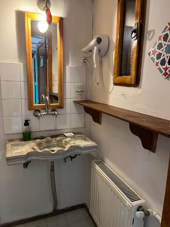 a bathroom with a sink and a mirror at Tuzla Yacht Club in Tuzla