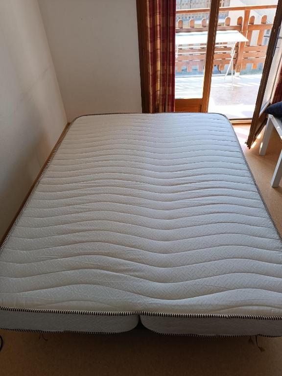 Posteľ alebo postele v izbe v ubytovaní Appartement A proximité d'Ax les thermes