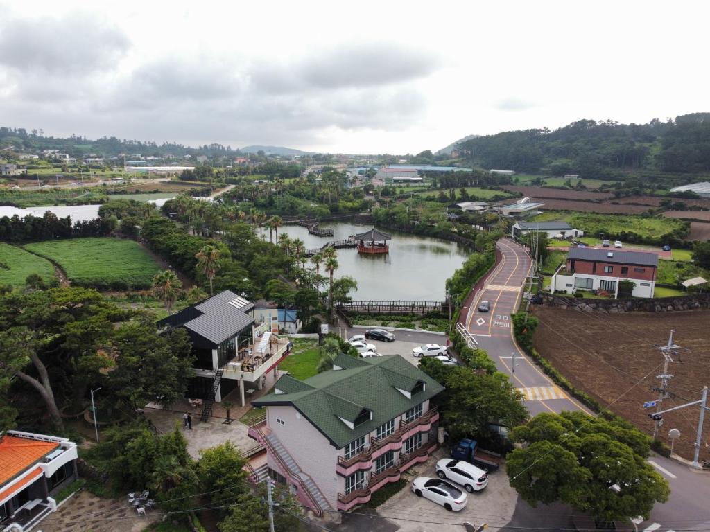 an aerial view of a town with a river at Yeonhwachon Pension in Jeju