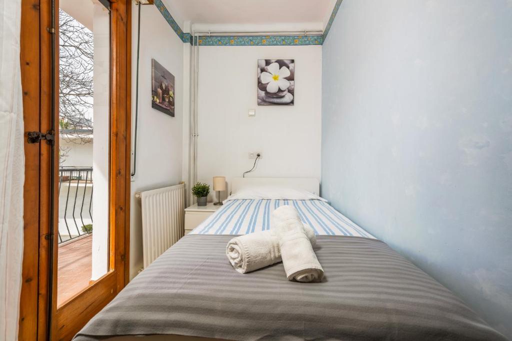 Postel nebo postele na pokoji v ubytování Hostal La Marina