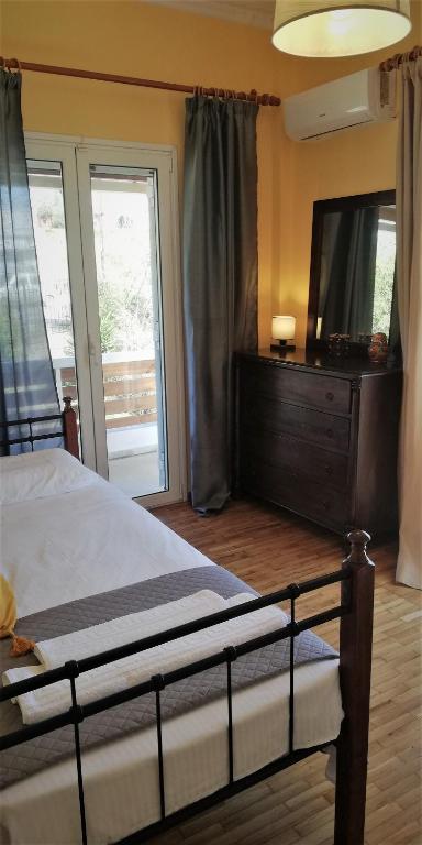 Postel nebo postele na pokoji v ubytování sapfo's house