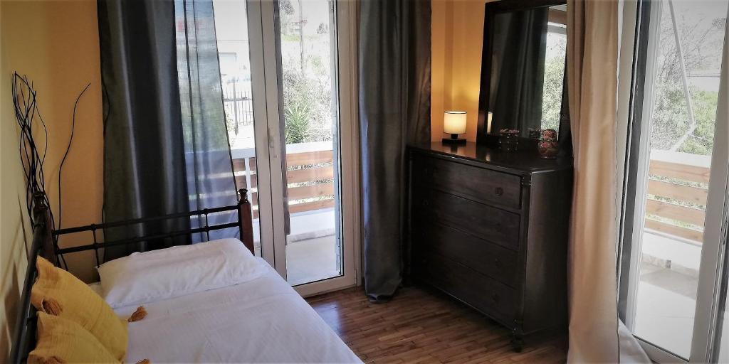 Postel nebo postele na pokoji v ubytování sapfo's house