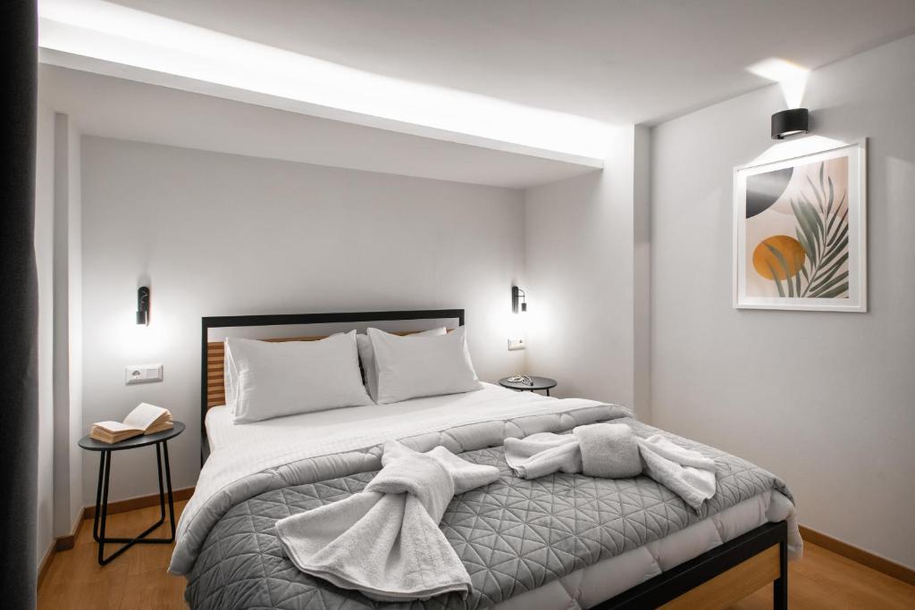 Postel nebo postele na pokoji v ubytování Traveleclectic Apartments