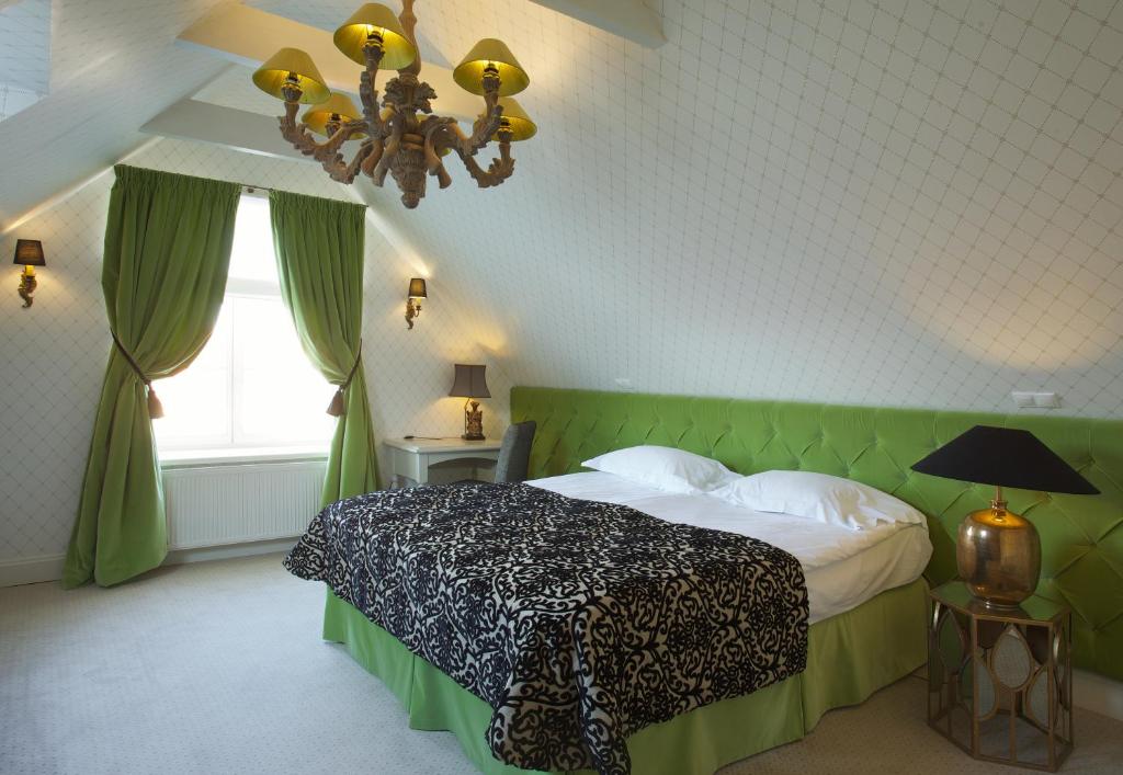 Postel nebo postele na pokoji v ubytování Hotel Apia