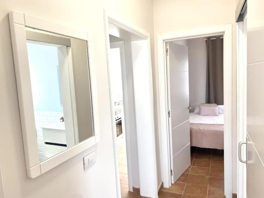 A bed or beds in a room at Adeje beach apartament + Parking