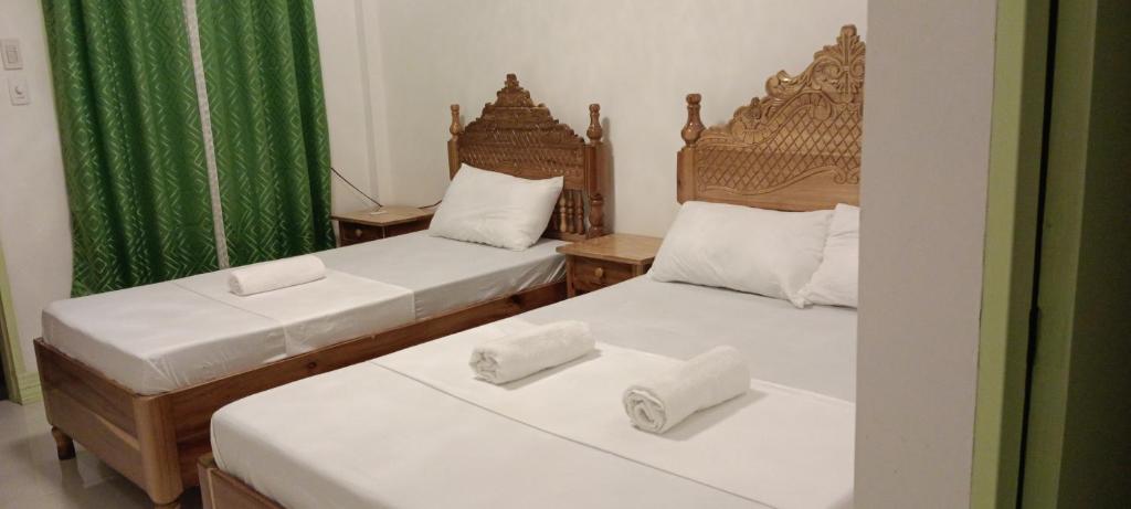 Postel nebo postele na pokoji v ubytování Rabang Traveller's Inn