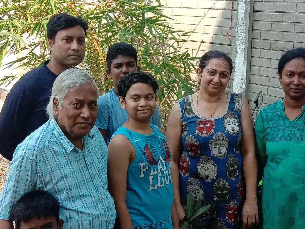 a group of people posing for a picture at ThendralHomeStay in Pondicherry