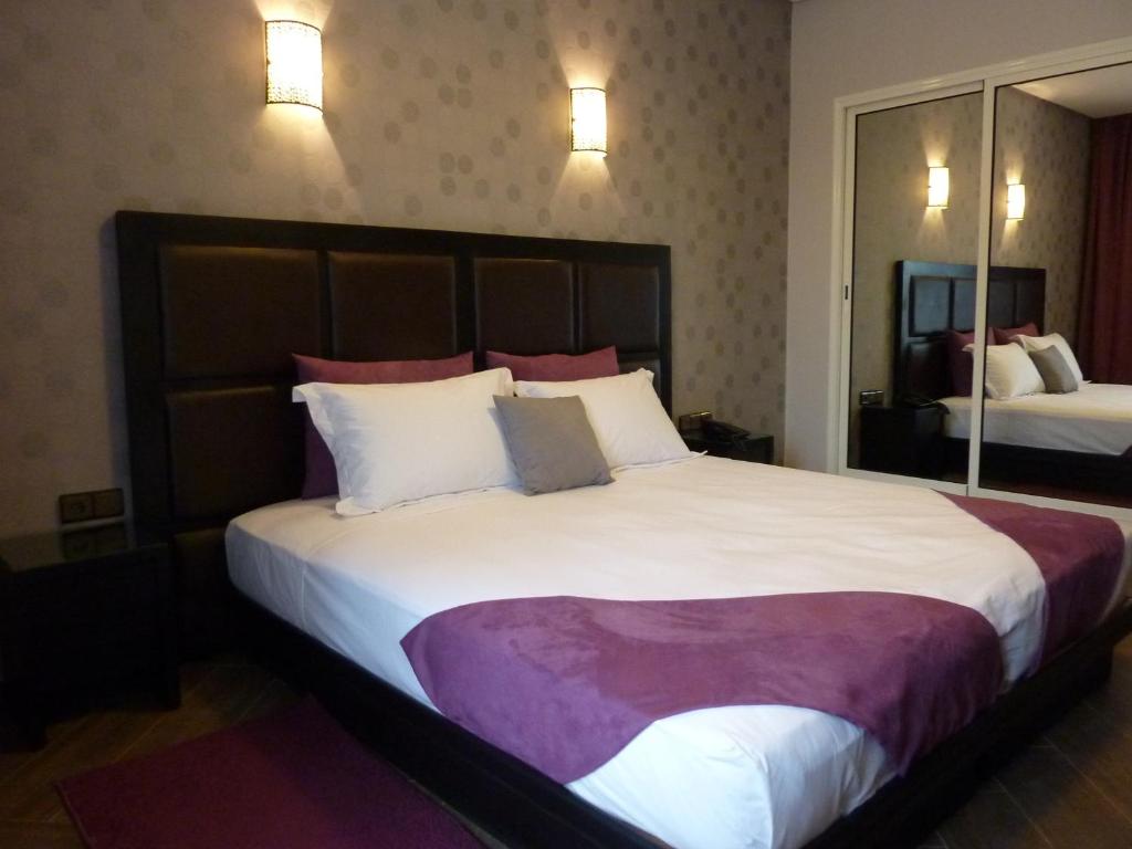 Postel nebo postele na pokoji v ubytování Hotel Swani