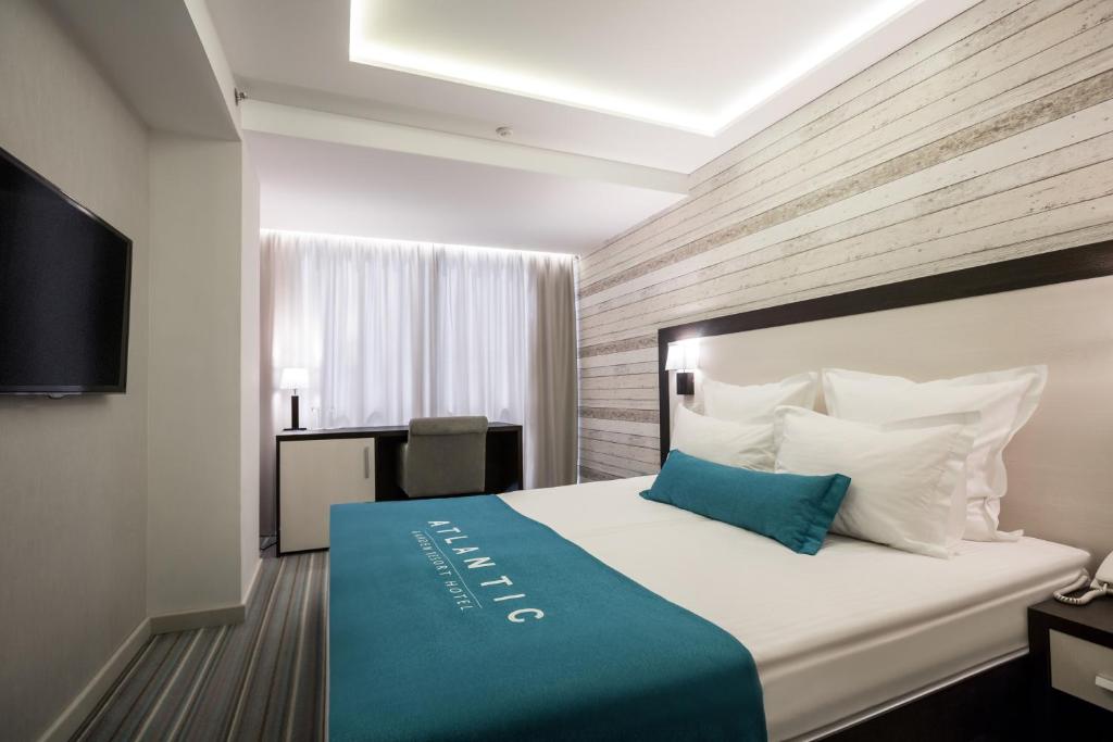 Postel nebo postele na pokoji v ubytování Atlantic Garden Resort