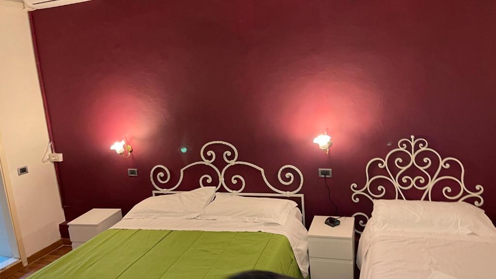 Postel nebo postele na pokoji v ubytování PICCOLO HOTEL Nel Centro Storico di Firenze