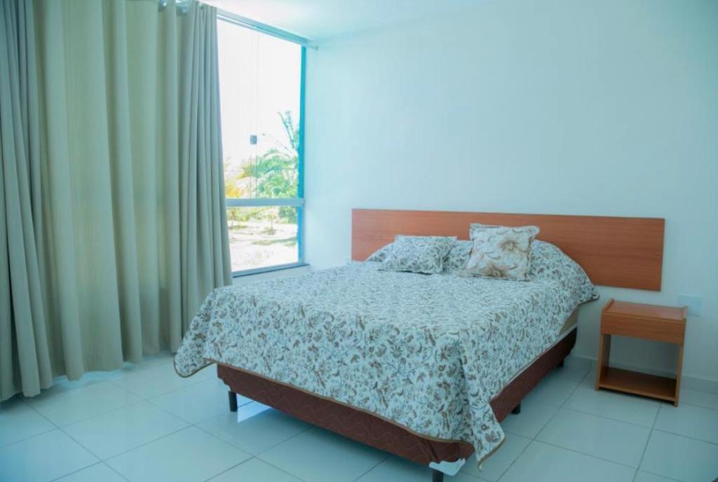 Posteľ alebo postele v izbe v ubytovaní Pousada Serra Mares