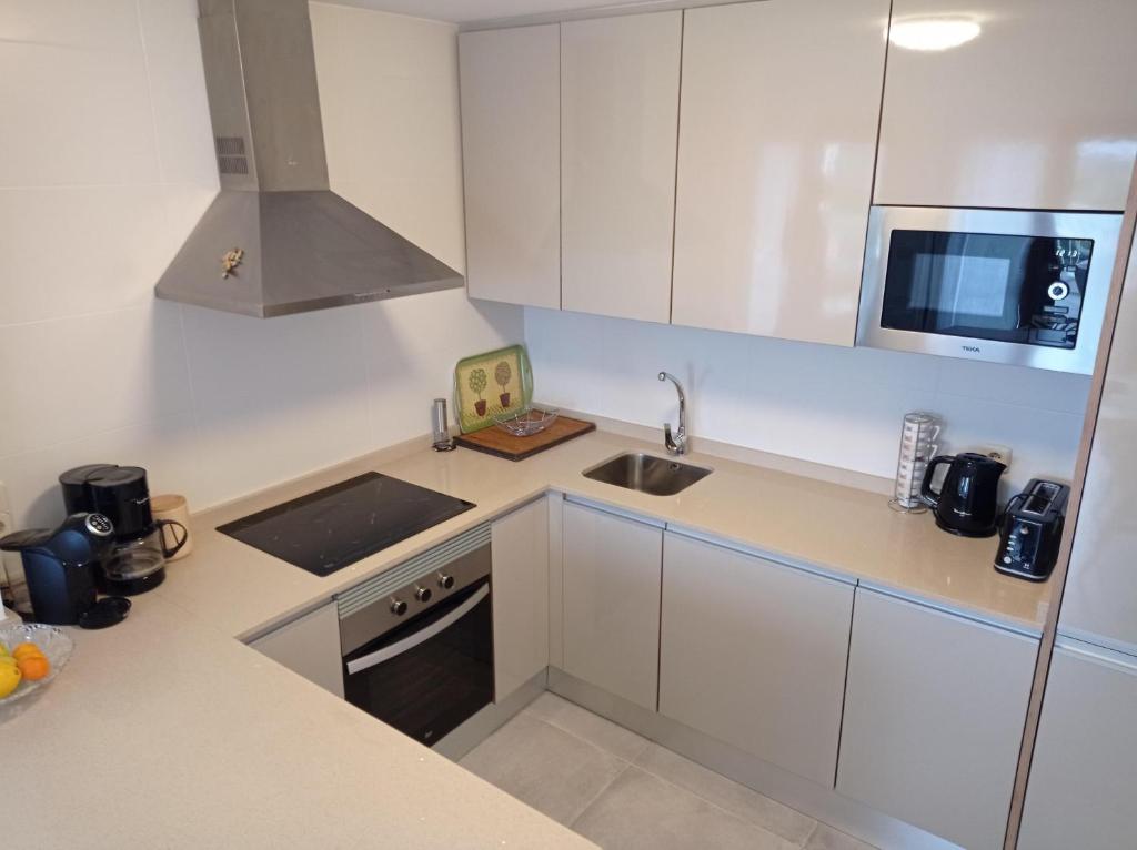 Kuchyň nebo kuchyňský kout v ubytování Residencial Xeresa del Monte Solo Familias Serviplaya