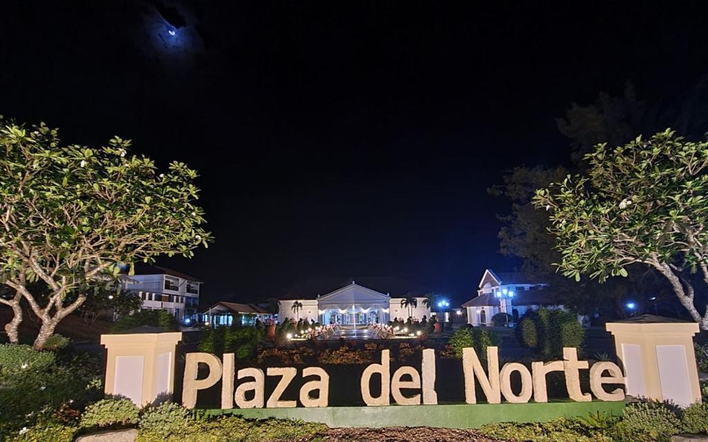 a sign that says pizza did notrite at night at Plaza Del Norte Hotel and Convention Center in Laoag