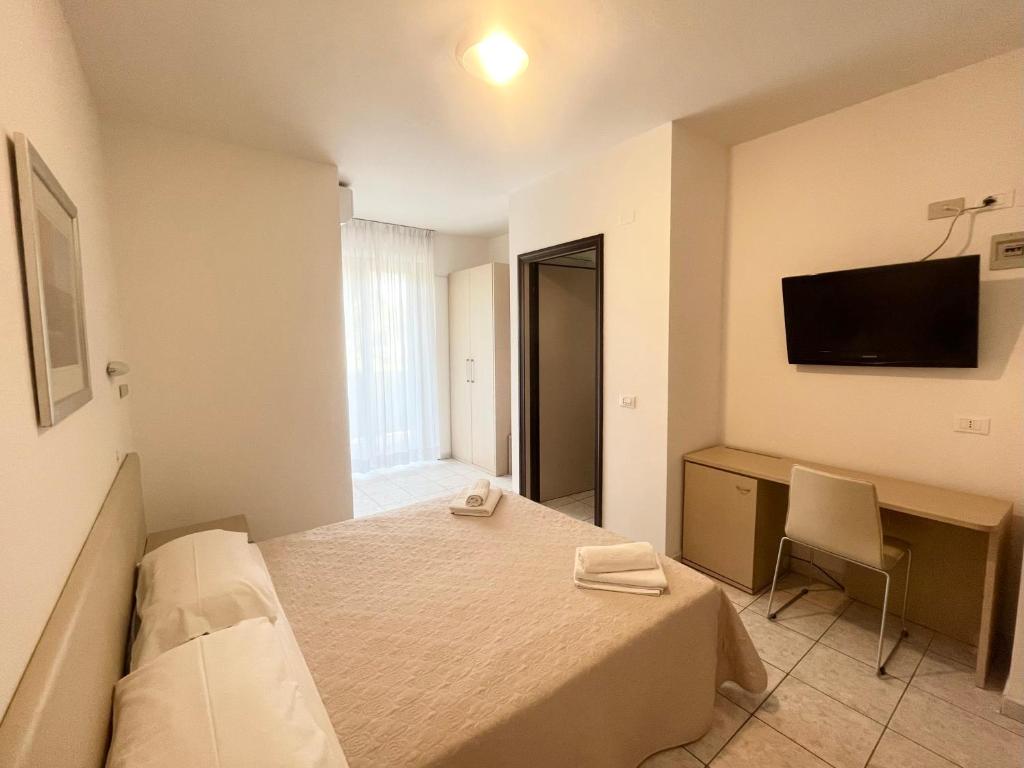 Postel nebo postele na pokoji v ubytování Hotel Rosen Garden