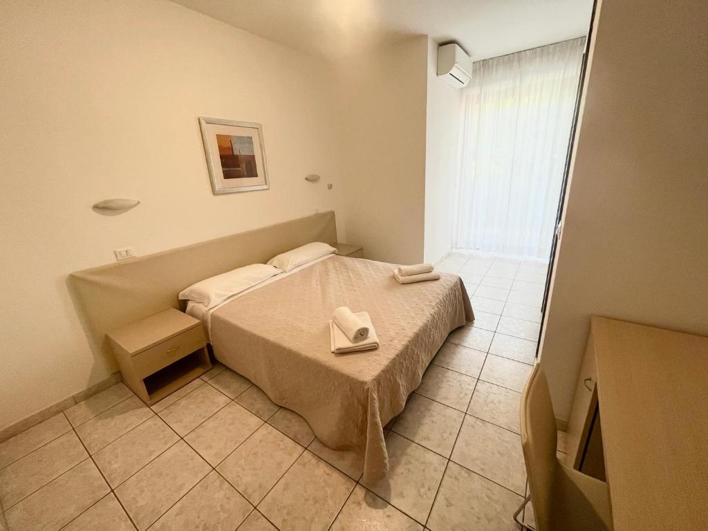 Postel nebo postele na pokoji v ubytování Hotel Rosen Garden