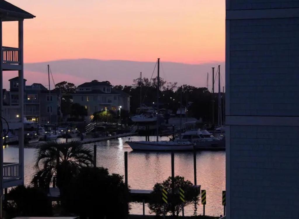 a marina at sunset with boats in the water at Endless Summer in Carolina Beach